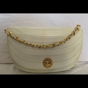 Authentic Chanel cream colored single lamb skin flap bag.